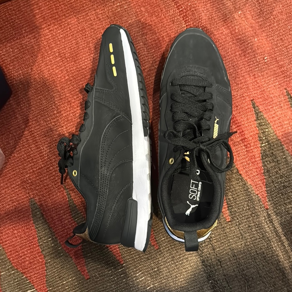 Puma Black and Gold Sleek Sneakers
